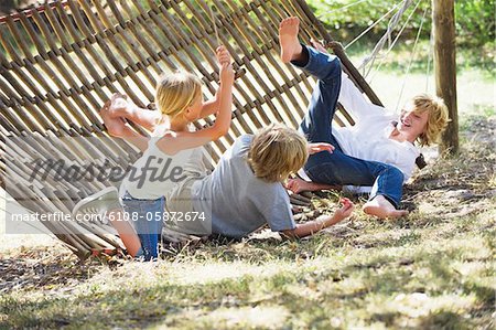 Little children falling down from hammock - Stock Photo - Masterfile -  Premium Royalty-Free, Code: 6108-05872674