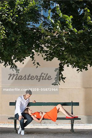 Couple on a bench in a garden, Terrasse De l'Orangerie, Jardin des Tuileries, Paris, Ile-de-France, France