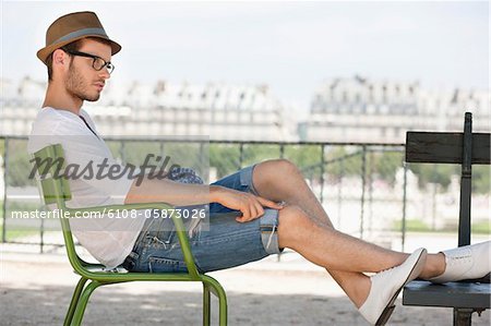 Man resting in a chair, Jardin des Tuileries, Paris, Ile-de-France, France