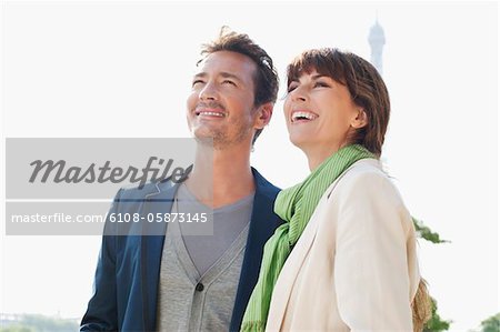 Happy couple with the Eiffel Tower in the background, Paris, Ile-de-France, France