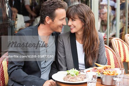 Romantic couple at a restaurant, Paris, Ile-de-France, France