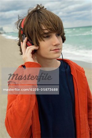 Close-up of a boy listening to headphones