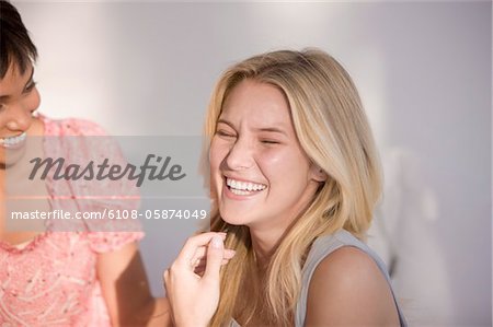 Close-up of two women laughing