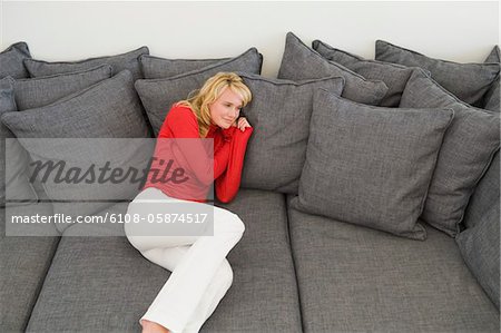 Woman reclining on a couch