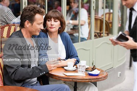 Couple sitting in a restaurant, Paris, Ile-de-France, France