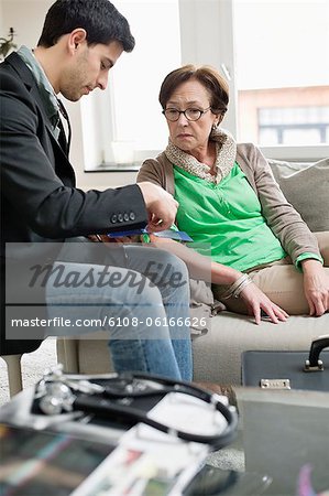 Male doctor examining a patient