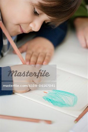 Close-up of a boy studying