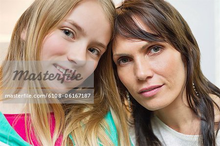 Portrait of mother and daughter smiling