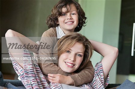 Portrait of a woman smiling with her son