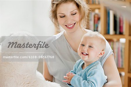 Women playing with her daughter and smiling