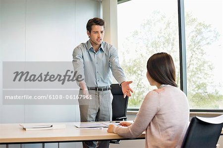 Business executive discussing with his client Business executive discussing with his client