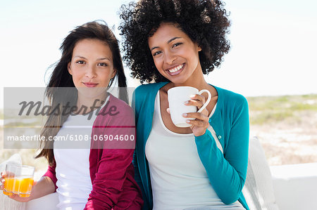 Portrait of a two female friends smiling