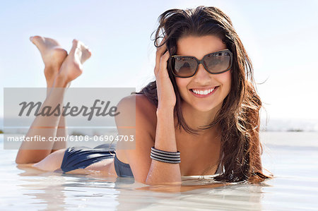 Beautiful woman lying on the beach