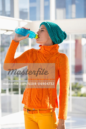 Woman drinking water from a bottle