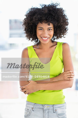 Woman standing with her arms crossed and smiling