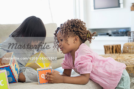 Two girls playing with number blocks