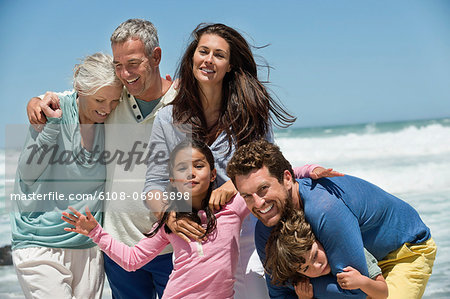 Family smiling on the beach