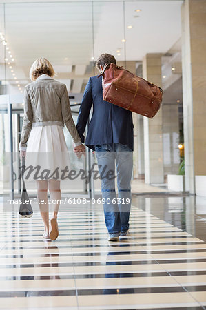 Couple walking at an airport