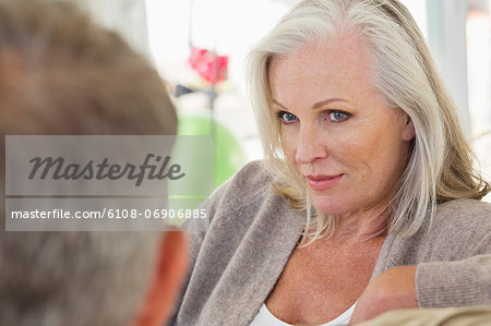 Close-up of a senior woman looking at her husband