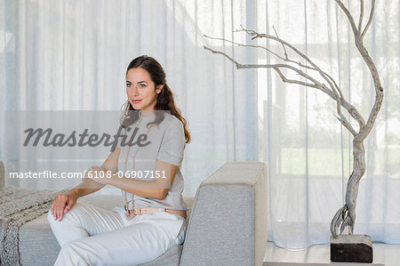 Beautiful woman sitting on a couch