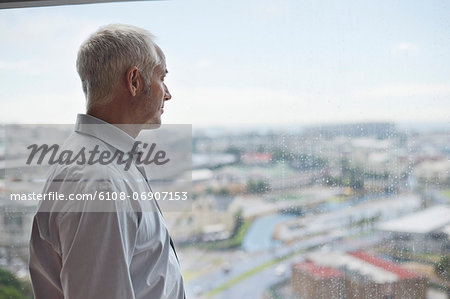 Man looking through a window