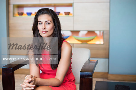 Portrait of a beautiful woman sitting on a chair