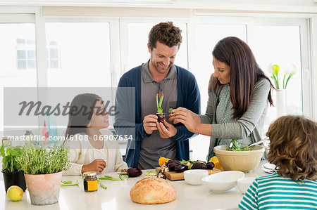 Family preparing food in the kitchen