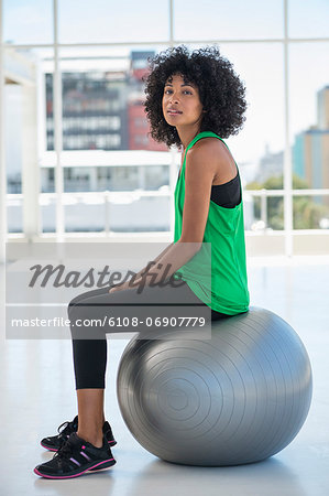 Portrait of a woman sitting on a fitness ball