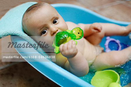 baby boy taking a bath