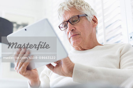 Senior man using a digital tablet