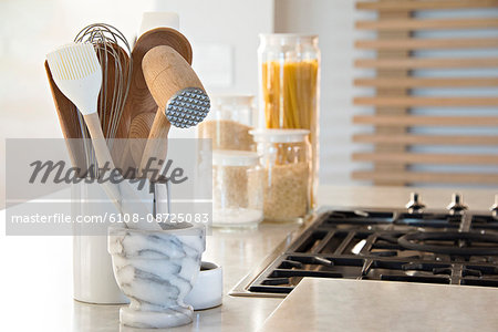 Close-up of kitchen utensils on worktop