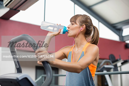 Premium Photo  Young woman working out in gym using gym equipment