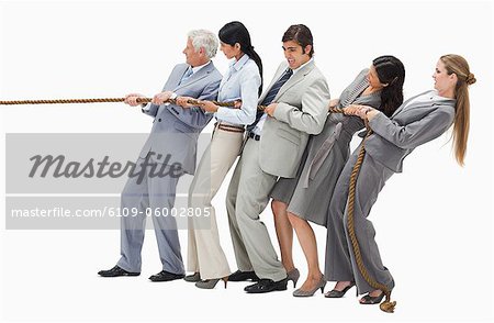 Business people pulling a rope against white background - Stock