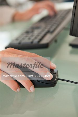 Woman S Hand Moving A Mouse On A Glass Desk Stock Photo