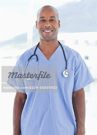 Smiling male doctor standing