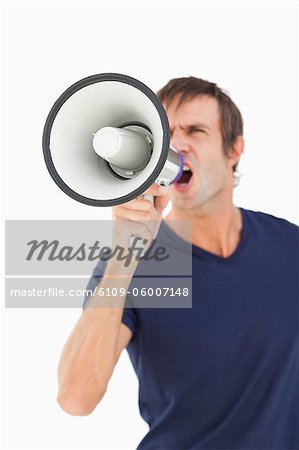 Megaphone held by a furious man against a white background