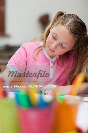 Elementary student focused on her exercise book