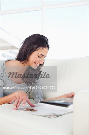 Close-up of a student leafing through a magazine