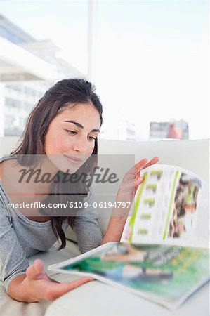 Close-up of a student reading a magazine