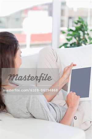 Brunette using a touch Pad