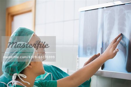 Two surgeons looking at x-rays