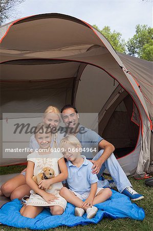 Smiling family on a camping holiday portrait