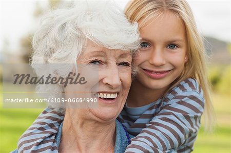 Elderly woman with her cute granddaughter portrait
