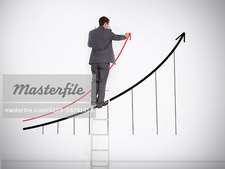 Businessman standing on ladder drawing graph Businessman standing on ladder drawing graph