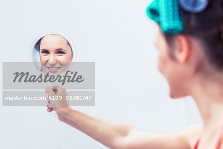 Young woman holding a mirror