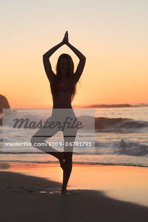 Sunset with woman doing yoga