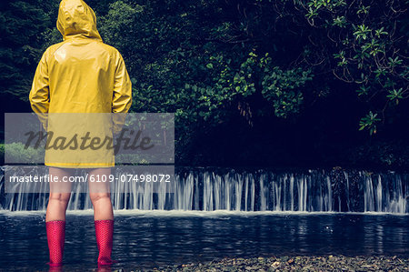 women's yellow raincoat and boots