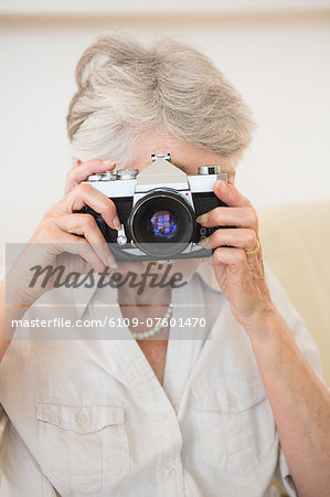 Senior woman taking a photograph