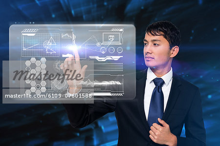 Serious businessman touching interface Serious businessman touching interface