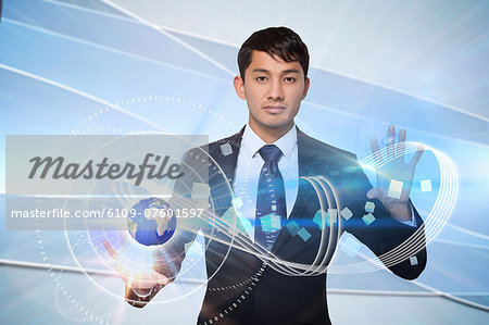 Serious businessman touching earth graphic